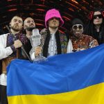 
              Kalush Orchestra from Ukraine celebrate after winning the Grand Final of the Eurovision Song Contest at Palaolimpico arena, in Turin, Italy, Saturday, May 14, 2022. (AP Photo/Luca Bruno)
            