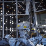 
              An Antonov An-124 cargo aircraft is seen in the hangar destroyed during recent fighting between Russian and Ukrainian forces, at the Antonov airport in Hostomel, on the outskirts of Kyiv, Ukraine, Thursday, May 5, 2022. (AP Photo/Efrem Lukatsky)
            