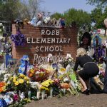 President Joe Biden and first lady Jill Biden visit Robb Elementary School to pay their respects to the victims of the mass shooting, Sunday, May 29, 2022, in Ulvade, Texas. (AP Photo/Evan Vucci)