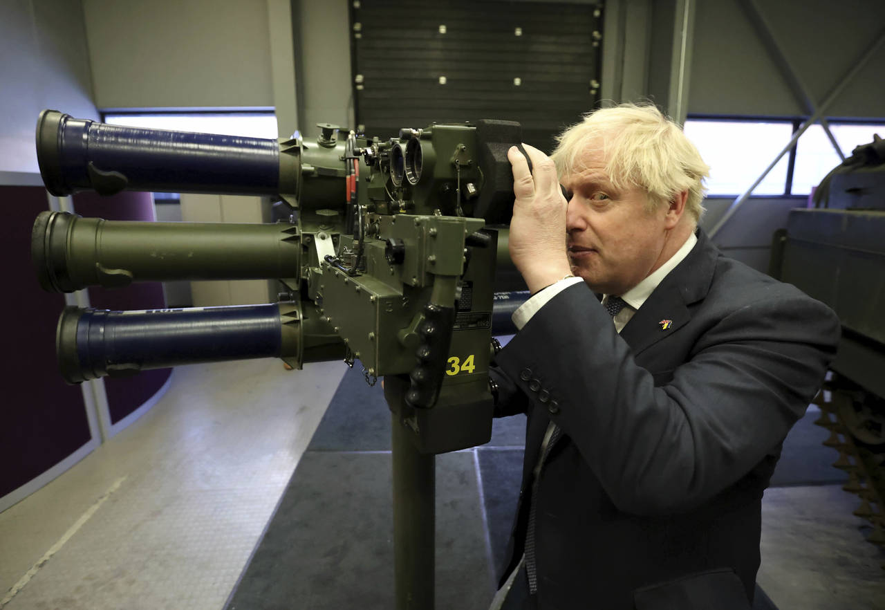 Britain's Prime Minister Boris Johnson with a Mark 3 shoulder launch LML (Lightweight Multiple Laun...