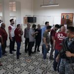 
              Policemen stand guard as people line up to vote in parliamentary elections, in the northern city of Tripoli, Lebanon, Sunday, May 15, 2022. Lebanese voted for a new parliament Sunday against the backdrop of an economic meltdown that is transforming the country and low expectations that the election would significantly alter the political landscape. (AP Photo/Bilal Hussein)
            