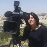 
              In this undated photo provided by Al Jazeera Media Network, Shireen Abu Akleh, a journalist for Al Jazeera network, stands next to a TV camera in an area where the Dome of the Rock shrine at Al-Aqsa Mosque in the Old City of Jerusalem is seen at left in the background. Abu Akleh, a well-known Palestinian female reporter for the broadcaster's Arabic language channel, was shot and killed while covering an Israeli raid in the occupied West Bank town of Jenin early Wednesday, May 11, 2022. (Al Jazeera Media Network via AP)
            