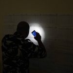 
              A policeman checks voters lists during parliamentary elections in Tripoli, Lebanon Saturday, May 14, 2022. (AP Photo/Bilal Hussein)
            