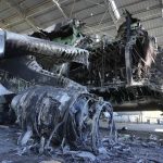 
              The gutted remains of an Antonov An-225, the world's biggest cargo aircraft, destroyed during recent fighting between Russian and Ukrainian forces, at the Antonov airport in Hostomel, on the outskirts of Kyiv, Ukraine, Thursday, May 5, 2022. (AP Photo/Efrem Lukatsky)
            