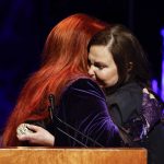 
              Ashley Judd, right, hugs sister Wynonna Judd during the Medallion Ceremony at the Country Music Hall Of Fame Sunday, May 1, 2022, in Nashville, Tenn. (Photo by Wade Payne/Invision/AP)
            