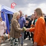 
              First lady Jill Biden visits with people during a visit to Vysne Nemecke, Slovakia, near the border with Ukraine, Sunday, May 8, 2022. Slovakia's Prime Minister Eduard Heger is at left. (AP Photo/Susan Walsh, Pool)
            