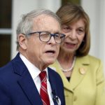
              Ohio Gov. Mike DeWine, left, and Ohio first lady Fran DeWine meet with reporters outside of their polling place after voting in Cedarville, Ohio, Tuesday, May 3, 2022. (AP Photo/Paul Vernon)
            