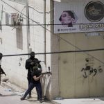 
              Palestinian gunmen take aim during an Israeli military operation in the West Bank town of Jenin, Friday, May 13, 2022. Israeli troops pushed into Jenin early Friday following the death of veteran Al Jazeera correspondent Shireen Abu Akleh on Wednesday when she was shot dead by Israeli forces while covering a military operation in the occupied West Bank. (AP Photo/Majdi Mohammed)
            