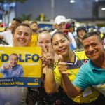 
              Supporters of Rodolfo Hernandez, presidential candidate with the Anti-corruption Governors League, pose for the camera as they celebrate favorable results at his election night headquarters in Bucaramanga, Colombia, Sunday, May 29, 2022. Hernandez will advance to a runoff contest in June after none of the six candidates in Sunday's first round got half the vote. (AP Photo/Mauricio Pinzon)
            