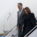 
              Vice President Kamala Harris and her husband Doug Emhoff step off Air Force Two at Buffalo Niagara International Airport, Saturday, May 28, 2022, in Buffalo, N.Y. Harris is attending a memorial service for Ruth Whitfield, a victim of the Buffalo supermarket shooting. (AP Photo/Patrick Semansky)
            