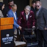 
              Jerry Lee Lewis is helped to a chair at the Country Music Hall of Fame after it was announced he will be inducted as a member Tuesday, May 17, 2022, in Nashville, Tenn. (AP Photo/Mark Humphrey)
            
