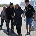 
              People board a transport during an evacuation of civilians on a road near Slovyansk, eastern Ukraine, Wednesday, May 4, 2022. (AP Photo/Andriy Andriyenko)
            