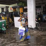 
              A woman leaves a fuel station empty-handed being unable to buy kerosene oil for cooking in Colombo, Sri Lanka, Thursday, May 19, 2022. (AP Photo/Eranga Jayawardena)
            