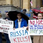 
              Demonstrators hold posters during an anti-war protest against the Russian invasion of Ukraine in Tbilisi, Georgia, Sunday, May 8, 2022, a day before Russia celebrates Victory Day, marking 77 years of the victory in WWII. (AP Photo/Shakh Aivazov)
            