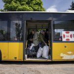 
              People stand in the bus during evacuation near Lyman, Ukraine, Wednesday, May 11, 2022. (AP Photo/Evgeniy Maloletka)
            