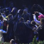 
              Kalush Orchestra from Ukraine celebrates after winning the Grand Final of the Eurovision Song Contest at Palaolimpico arena, in Turin, Italy, Saturday, May 14, 2022. (AP Photo/Luca Bruno)
            