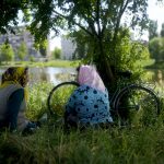 
              Two women talk in a park in Borodyanka, on the outskirts of Kyiv, Ukraine, Tuesday, May 31, 2022. (AP Photo/Natacha Pisarenko)
            
