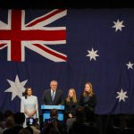 
              Australian Prime Minister Scott Morrison address a Liberal Party function with his wife Jenny and daughter's Lily and Abbey in Sydney, Australia, Saturday, May 21, 2022. Morrison has conceded defeat and has confirmed that he would hand over the leadership of the Liberal Party following his party's loss to Labor in today's federal election. (AP Photo/Mark Baker)
            
