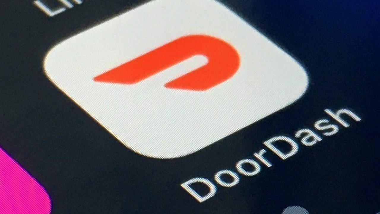 The DoorDash app is shown on a smartphone on Feb. 27, 2020, in New York. (AP Photo/File)...