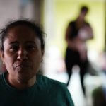 
              Iracema Figueroa, left, of Honduras, looks on at a shelter for migrants Friday, May 20, 2022, in Tijuana, Mexico. Figueroa has spent two years trying to reach a safe place for her family and was praying the judge would lift the order. Figueroa left Honduras in 2019 after gangs killed her uncle and threatened her three sons. (AP Photo/Gregory Bull)
            