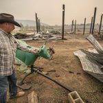 
              Standing in the burned out wreckage of his barn on May 12, 2022, John Martinez of Las Vegas, who has a 16-acre spread in Manuelitas, N.H., talks about the capricious fire that left his house untouched but destroyed a $3,000 roping horse just hours after he and his wife evacuated. (Jim Weber/Santa Fe New Mexican via AP)
            