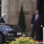 
              British Prime Minister Boris Johnson, left, gets out of a car as he is welcomed by Mark Larmour from the Northern Ireland Office upon his arrival at Hillsborough Castle, Northern Ireland, Monday, May 16, 2022. Johnson on Monday renewed British threats to break a Brexit agreement with the European Union, blaming it for a political crisis that's blocking the formation of a new government in Northern Ireland. (Liam McBurney/PA Wire/PA via AP)
            