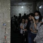 
              Lebanese women line up to vote at a Druze religious institute in the mountain town of Aley east of Beirut, Lebanon, Sunday, May 15, 2022. Lebanese voted for a new parliament Sunday against the backdrop of an economic meltdown that is transforming the country and low expectations that the election would significantly alter the political landscape. (AP Photo/Hassan Ammar)
            