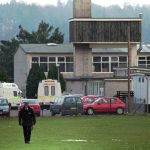 
              FILE - A police officer walks on the grounds of the Dunblane Primary School in Dunblane, Scotland, where a lone gunman burst into the school's gymnasium killing 16 children, one teacher, and himself Wednesday, March 13, 1996.    The 1996 massacre in Dunblane led to a ban on owning handguns in the U.K. While Britain is not immune to gun violence, there have been no school shootings in the quarter century since. (AP Photo/Lynne Sladky, File)
            