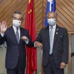 
              In this photo released by Xinhua News Agency, Secretary-General Pacific Islands Forum Secretariat Henry Puna, right, and visiting Chinese Foreign Minister Wang Yi pose for a photo before their meeting in Suva, Fiji, Sunday, May 29, 2022. (Zhang Yongxing/Xinhua via AP)
            