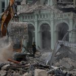 
              Rescue teams remove debris from the site of a deadly explosion that destroyed the five-star Hotel Saratoga, in Havana, Cuba, Friday, May 6, 2022. A powerful explosion apparently caused by a natural gas leak killed at least 18 people, including a pregnant woman and a child, and injured dozens Friday when it blew away outer walls from the luxury hotel in the heart of Cuba’s capital. (AP Photo/Ramon Espinosa)
            