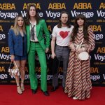 
              Members of the band Blossoms, centre right and center left, arrive for the ABBA Voyage concert at the ABBA Arena in London, Thursday May 26, 2022. ABBA is releasing its first new music in four decades, along with a concert performance that will see the "Dancing Queen" quartet going entirely digital. The virtual version of the band will begin a series of concerts on Thursday. (AP Photo/Alberto Pezzali)
            