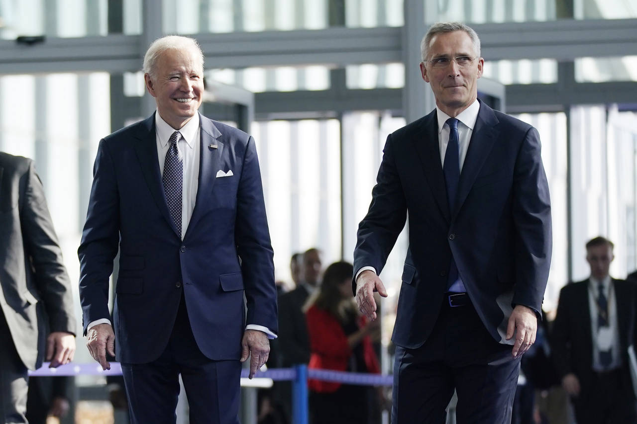 FILE - President Joe Biden is greeted by NATO Secretary General Jens Stoltenberg as he arrives for ...