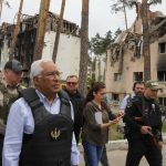 
              Portuguese Prime Minister Antonio Costa, center left, walks surrounded by media and security in Irpin, Ukraine, Saturday, May 21, 2022. (AP Photo/Efrem Lukatsky)
            