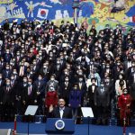 
              South Korean President Yoon Suk Yeol front center, takes an oath during his inauguration in front of the National Assembly in Seoul, South Korea, Tuesday, May 10, 2022. South Korea's new president says he'll present "an audacious plan" to improve North Korea's economy if it denuclearizes. Yoon Suk Yeol made the offer during a speech at his inauguration ceremony in Seoul on Tuesday. (Jeon Heon-kyun/Pool Photo via AP)
            