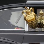 
              Cars carrying the crown leave Buckingham Palace for the State Opening of Parliament, at the Palace of Westminster in London, Tuesday, May 10, 2022. Buckingham Palace said Queen Elizabeth II will not attend the opening of Parliament on Tuesday amid ongoing mobility issues. (AP Photo/Frank Augstein)
            