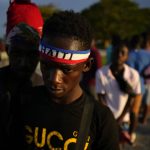 
              Haitians wait to be processed and receive medical attention at a tourist campground in Sierra Morena, in the Villa Clara province of Cuba, Wednesday, May 25, 2022. A vessel carrying more than 800 Haitians trying to reach the United States wound up instead on the coast of central Cuba, government news media said Wednesday. (AP Photo Ramon Espinosa)
            