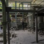 
              A man takes pictures inside a destroyed boiler room in Kharkiv, eastern Ukraine, Thursday, May 19, 2022. The building was shelled early Thursday. (AP Photo/Bernat Armangue)
            