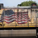 
              FILE - An American flag is emblazoned on this Union Pacific Railroad locomotive sitting in the Jackson, Miss., terminal rail yard, Wednesday, April 20, 2022.  A federal judge has ruled that the details of conversations between the nation’s four largest railroads should be included in lawsuits challenging billions of dollars of charges the railroads imposed in the past. (AP Photo/Rogelio V. Solis File)
            