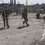 
              In this photo taken from a video released by the Russian Defense Ministry Press Service on Wednesday, May 18, 2022, shows Ukrainian servicemen as they leave the besieged Azovstal steel plant in Mariupol, Ukraine. (Russian Defense Ministry Press Service via AP)
            