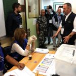 
              György Hölvényi, the chief observer of the European Union Election Observation Mission, right, speaks with an electoral workers during his visit to a ballot station, in Beirut, Lebanon, Sunday, May 15, 2022. Lebanese voted for a new parliament Sunday against the backdrop of an economic meltdown that is transforming the country and low expectations that the election would significantly alter the political landscape. (AP Photo/Hussein Malla)
            