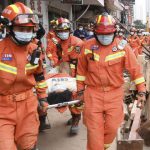 
              In this photo released by Xinhua News Agency, rescuers evacuate a woman pulled alive from a collapsed building in Changsha, central China's Hunan Province, May 1, 2022. The woman was rescued Sunday from the rubble of a building in central China more than 50 hours after it collapsed, leaving dozens trapped or missing, state media said. (Shen Hong/Xinhua via AP)
            