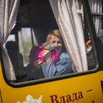 
              A woman waits in a bus to be processed as she arrives to a reception center for displaced people in Zaporizhzhia, Ukraine, Monday, May 2, 2022. Thousands of Ukrainian continue to leave Russian occupied areas. (AP Photo/Francisco Seco)
            