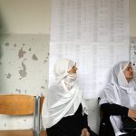 
              Druze Lebanese women wait to vote at a Druze religious institute in the mountain town of Aley east of Beirut, Lebanon, Sunday, May 15, 2022. Lebanese voted for a new parliament Sunday against the backdrop of an economic meltdown that is transforming the country and low expectations that the election would significantly alter the political landscape. (AP Photo/Hassan Ammar)
            