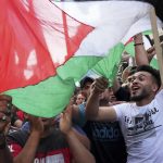 
              Hamas supporters chant Islamic slogans while waving Palestinian flags during a protest against the Israeli flags march to mark Jerusalem Day, an Israeli holiday celebrating the capture of the Old City of Jerusalem during the 1967 Mideast war, in the Jebaliya refugee camp, northern Gaza Strip, Sunday, May 29, 2022. (AP Photo/Adel Hana)
            