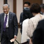 
              Malaysia's former Prime Minister Mahathir Mohamad walks after speaking at a session of the International Conference on "The Future of Asia" Friday, May 27, 2022 in Tokyo. (AP Photo/Eugene Hoshiko)
            