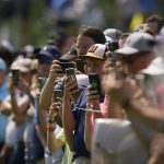 
              Fans watch on the eighth hole during a practice round for the PGA Championship golf tournament, Wednesday, May 18, 2022, in Tulsa, Okla. (AP Photo/Matt York)
            