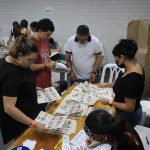 
              Election workers count ballots at a closed polling station on the day of presidential elections in Medellin, Colombia, Sunday, May 29, 2022. (AP Photo/Jaime Saldarriaga)
            
