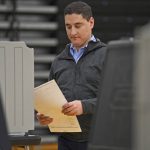 
              U.S. Senate Republican candidate Josh Mandel enters the polling booth at Beachwood High School, Tuesday, May 3, 2022, in Beachwood, Ohio. (AP Photo/David Dermer)
            