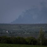 
              A smoke rises near a facility in Luhansk region, Ukraine, on Thursday, May 12, 2022. (AP Photo/Evgeniy Maloletka)
            