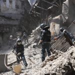 
              Donetsk People Republic Emergency Situations Ministry employees clear rubble at the side of the damaged Mariupol theater building during heavy fighting in Mariupol, in territory under the government of the Donetsk People's Republic, eastern Ukraine, Thursday, May 12, 2022. (AP Photo)
            